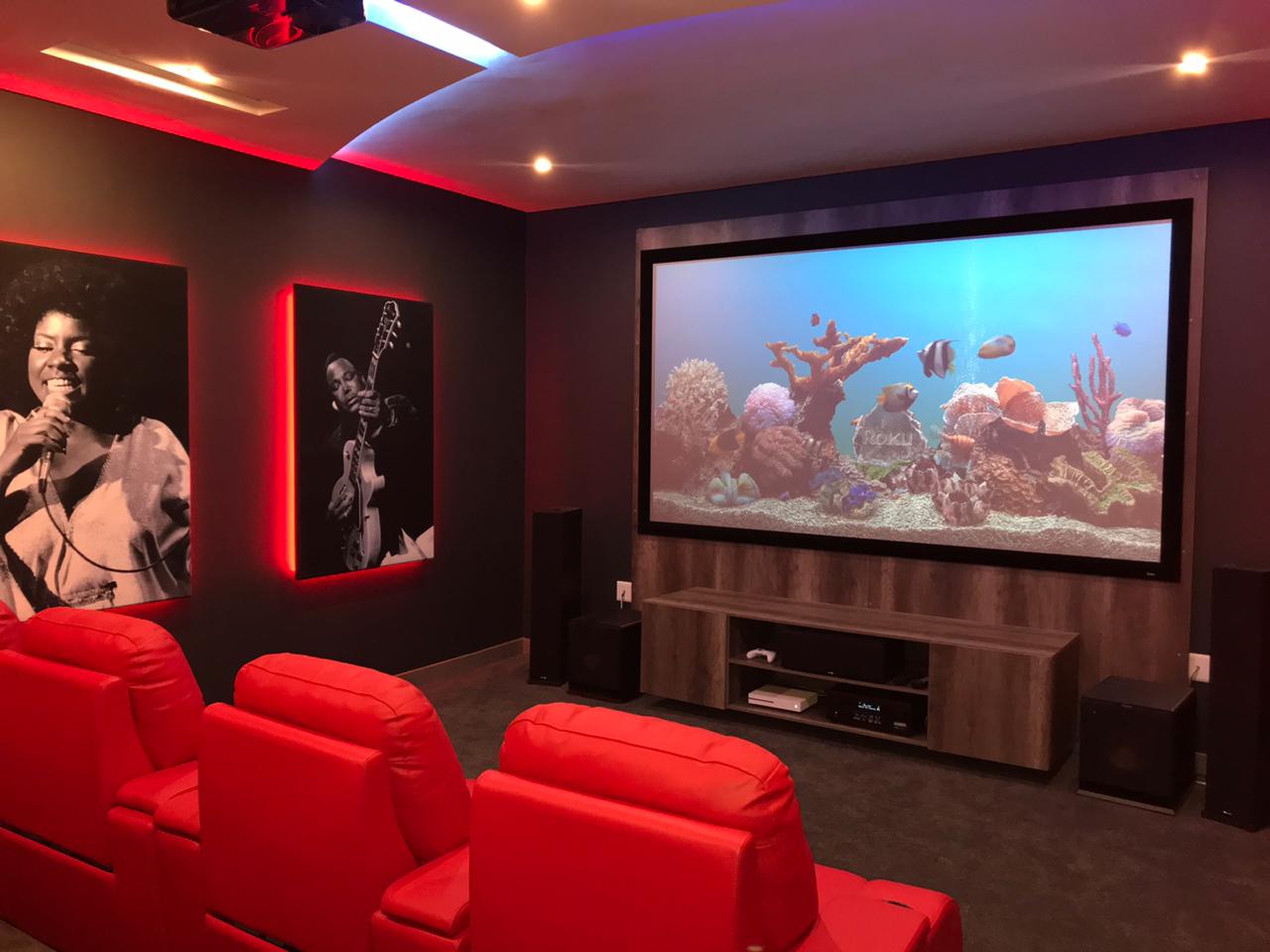 Private cinema in Centurion with tiered seating and cove lighting