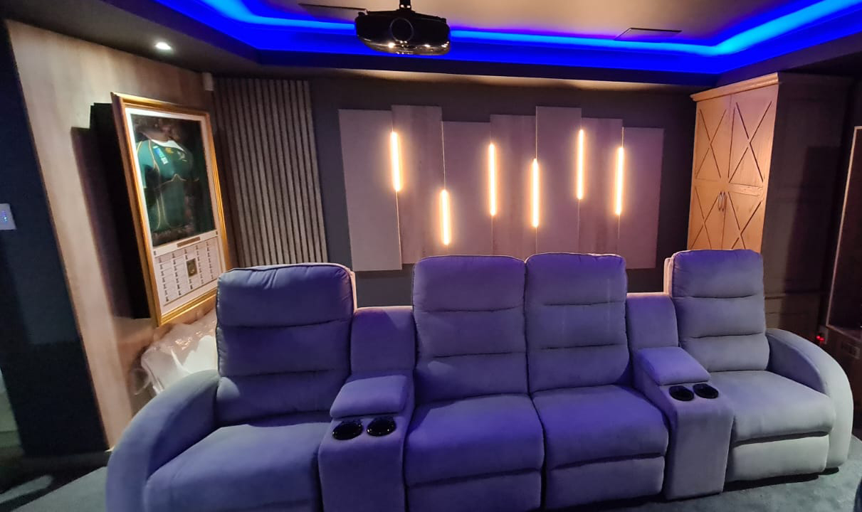 Private cinema in Featherbrook with a wide screen and acoustic panelling
