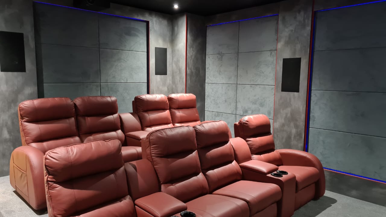 Steyn City home cinema with a wide screen and starlit ceiling